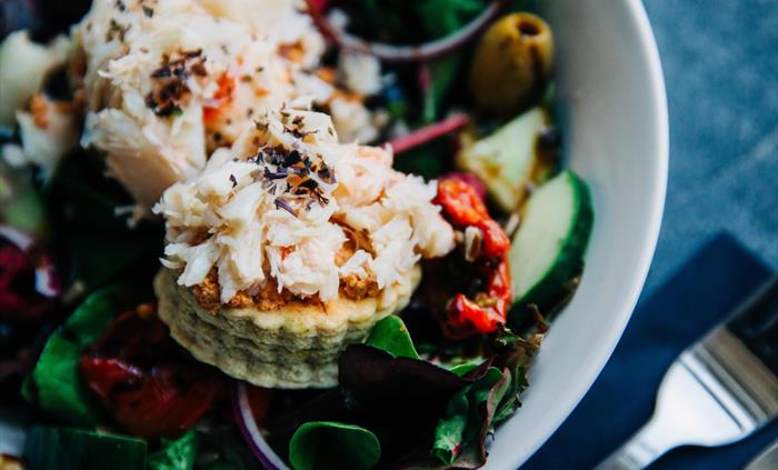 Fresh crab salad on a savoury welsh cake at MamGu Welshcakes St Davids Cafe, St Davids Cathedral, Pembrokeshire